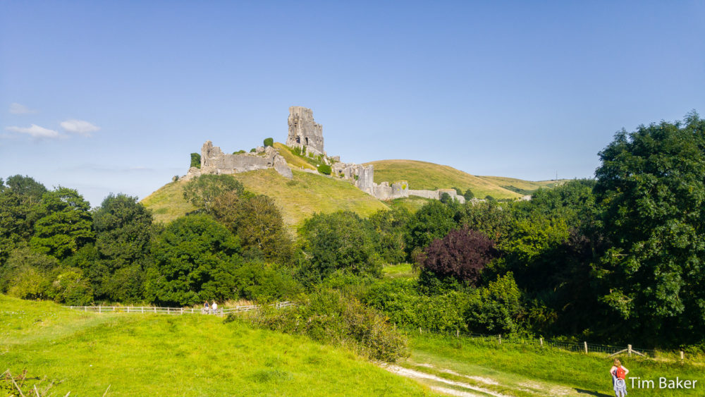 View of Corfe Castle, Woman added for scale.