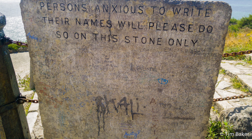 Obviously a solution to Victorian Graffiti Artists With a Chisel - provide a wall for them to sign! Reads "Persons Anxious To Write Their Name Please Do So On This Stone Only" Durlston Castle, Swanage.