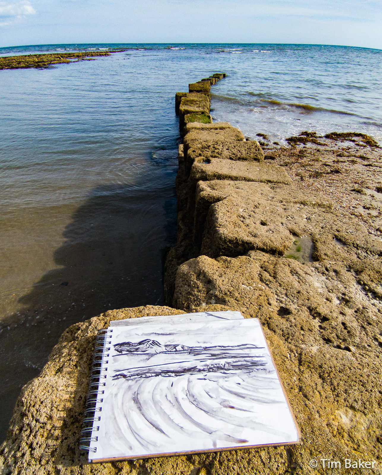 Drawing as the tide comes in, East Cliff, Lyme Regis